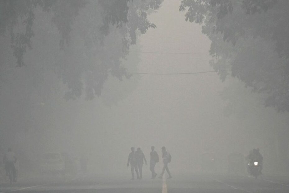 Air pollution haze over a major Indian city with monitoring graph overlay