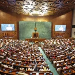 Lok Sabha Speaker presiding over Indian Parliament with committee desks