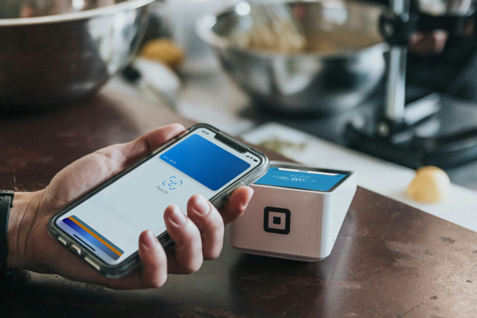 Illustration of a smartphone confirming a UPI payment with security shield icons