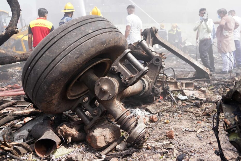 Air India Airbus A350 parked on apron with maintenance crew near engine