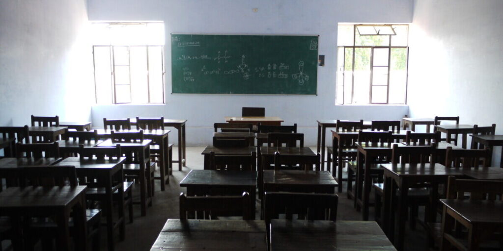 Classroom desks in an Indian school used as a representational image