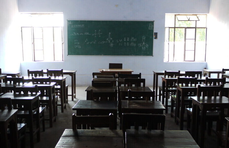 Classroom desks in an Indian school used as a representational image